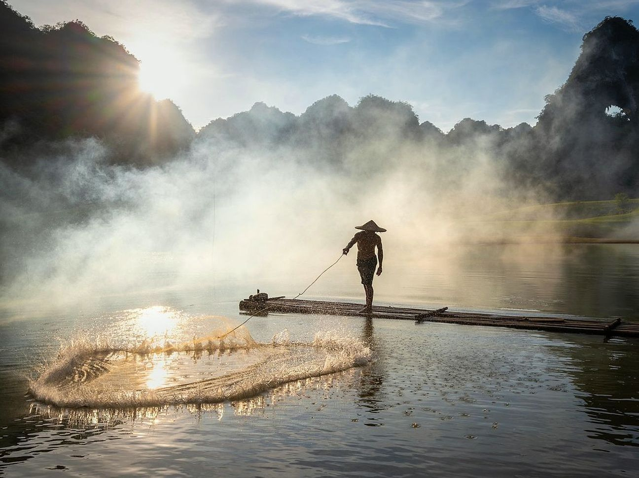 Sunrise mist over a narrow inlet